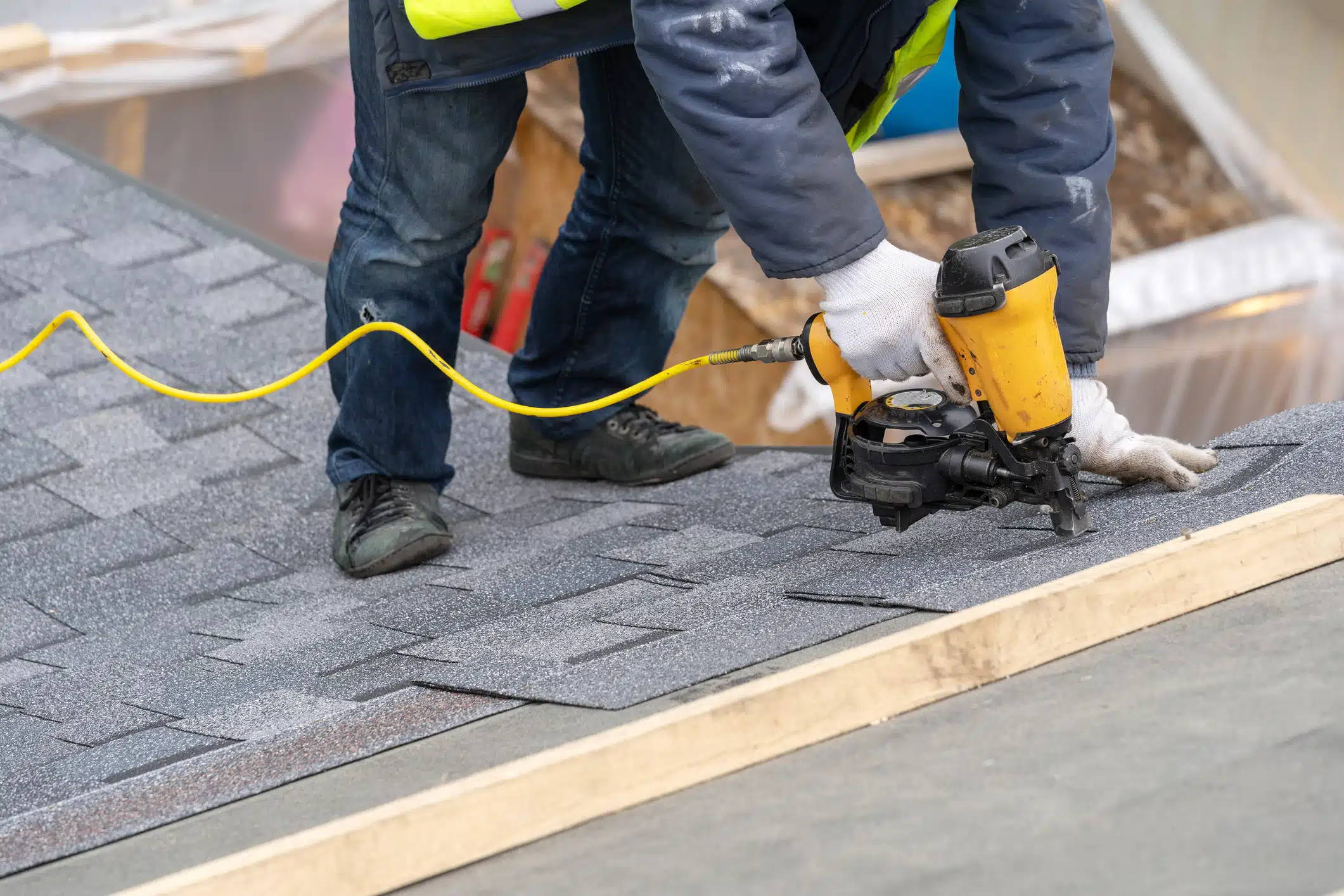 man doing a roof installation