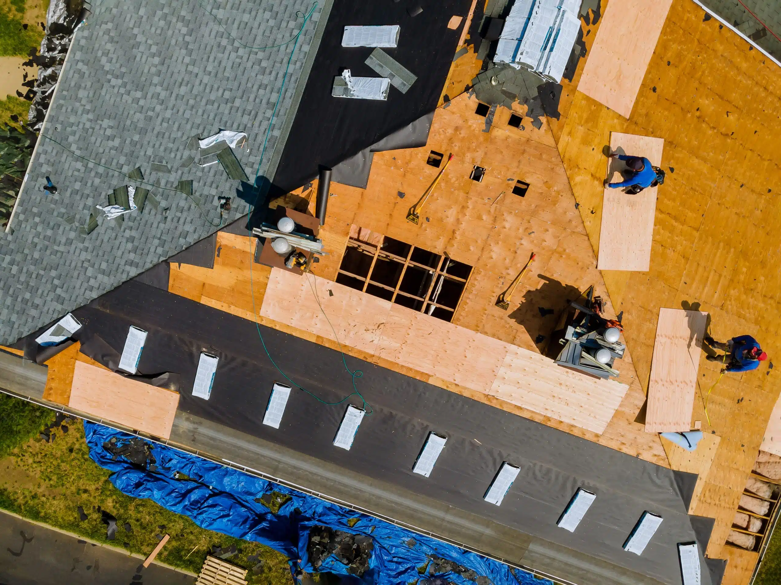 A view of a house repairing the roof.