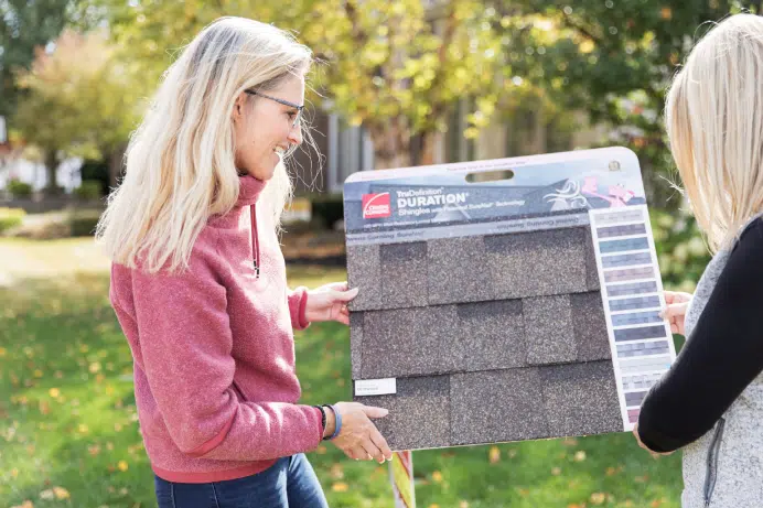 Women looking at roof types and style samples