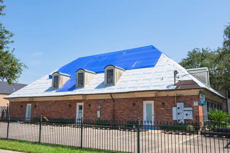 topview of roof of a commercial building with roof tarping 