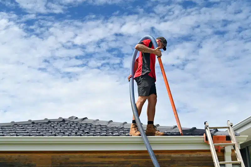 Man doing a gutter inspection