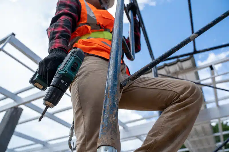 man with drill working on roof renewal