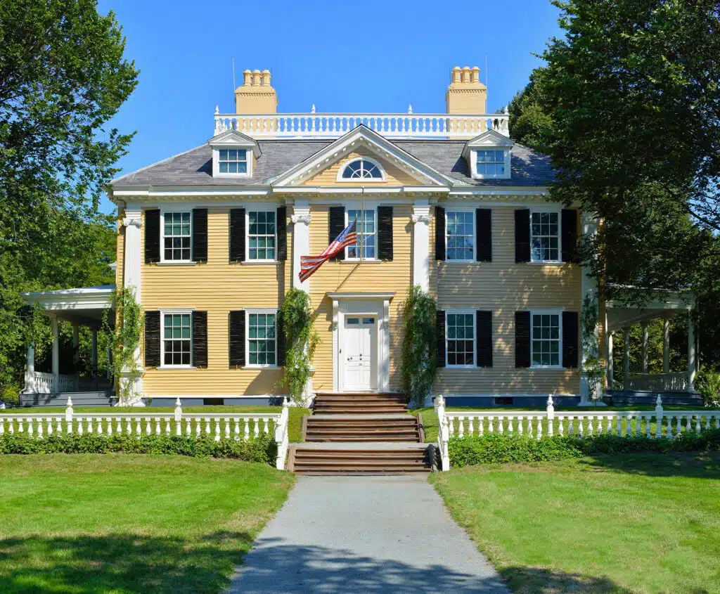 historic yellow home with new roof