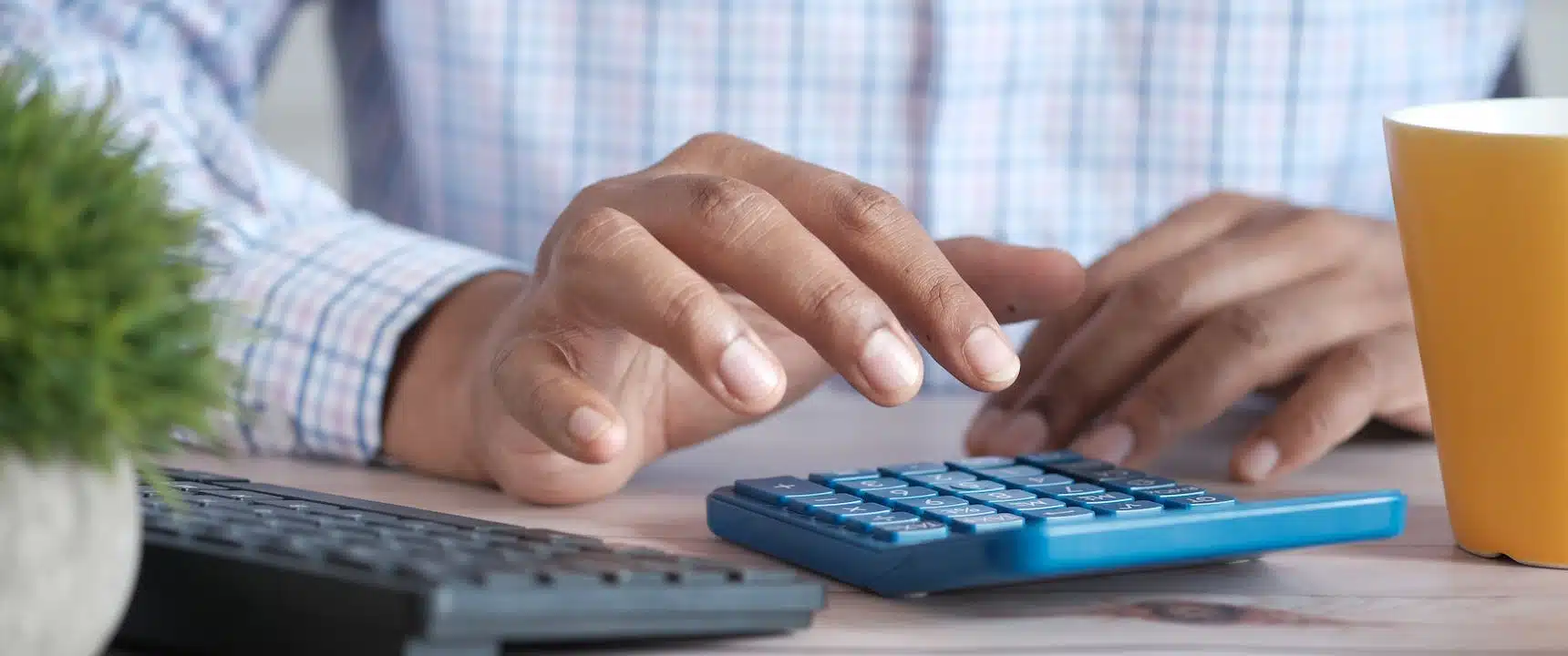 man calculating the cost of Home Increase with a New Roof