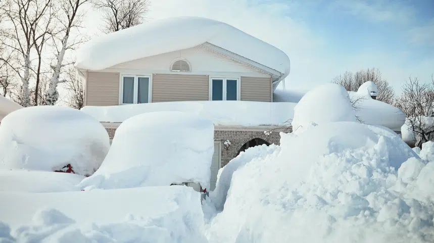 A house surrounded by snow.