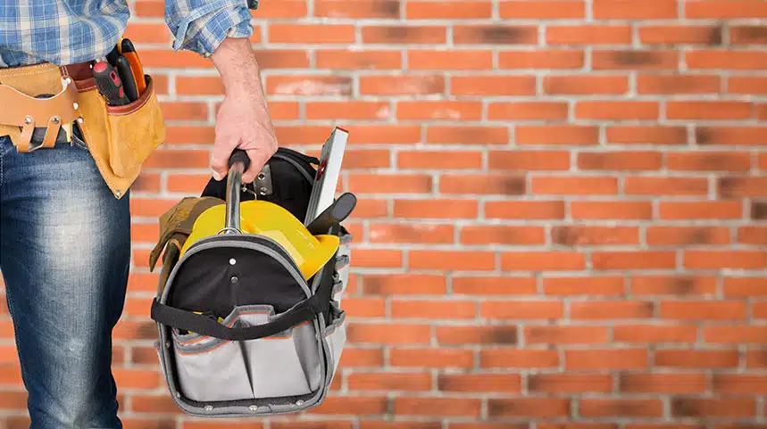 A maintenance staff holding a tools