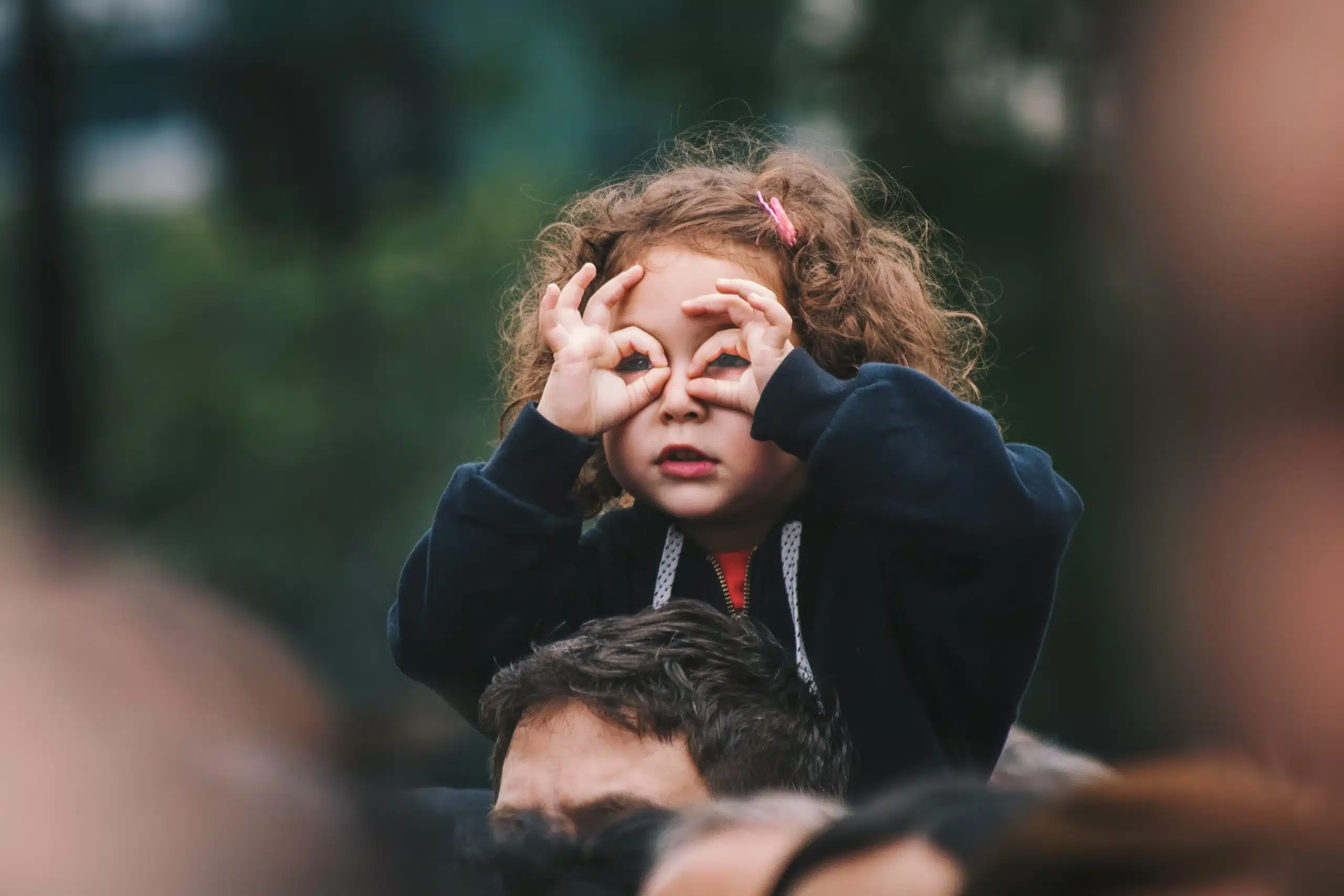 A little girl playing with her hands