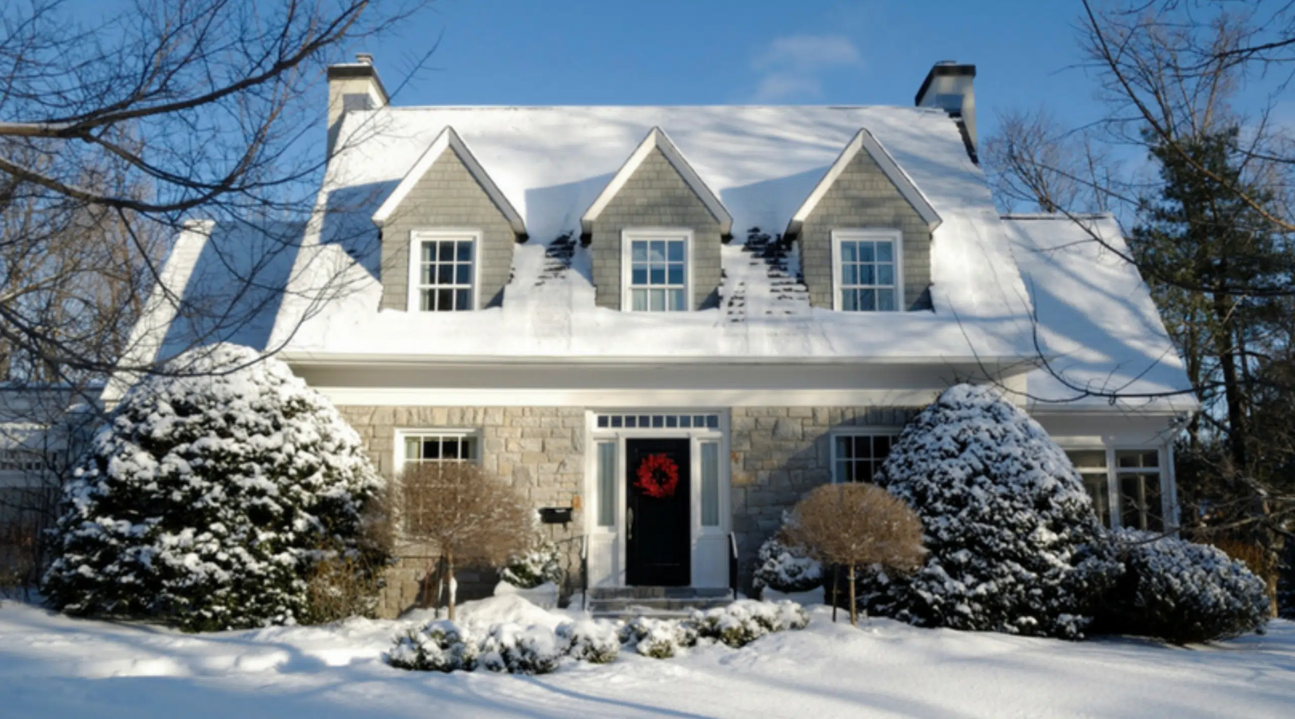 White modern house covered by a snow