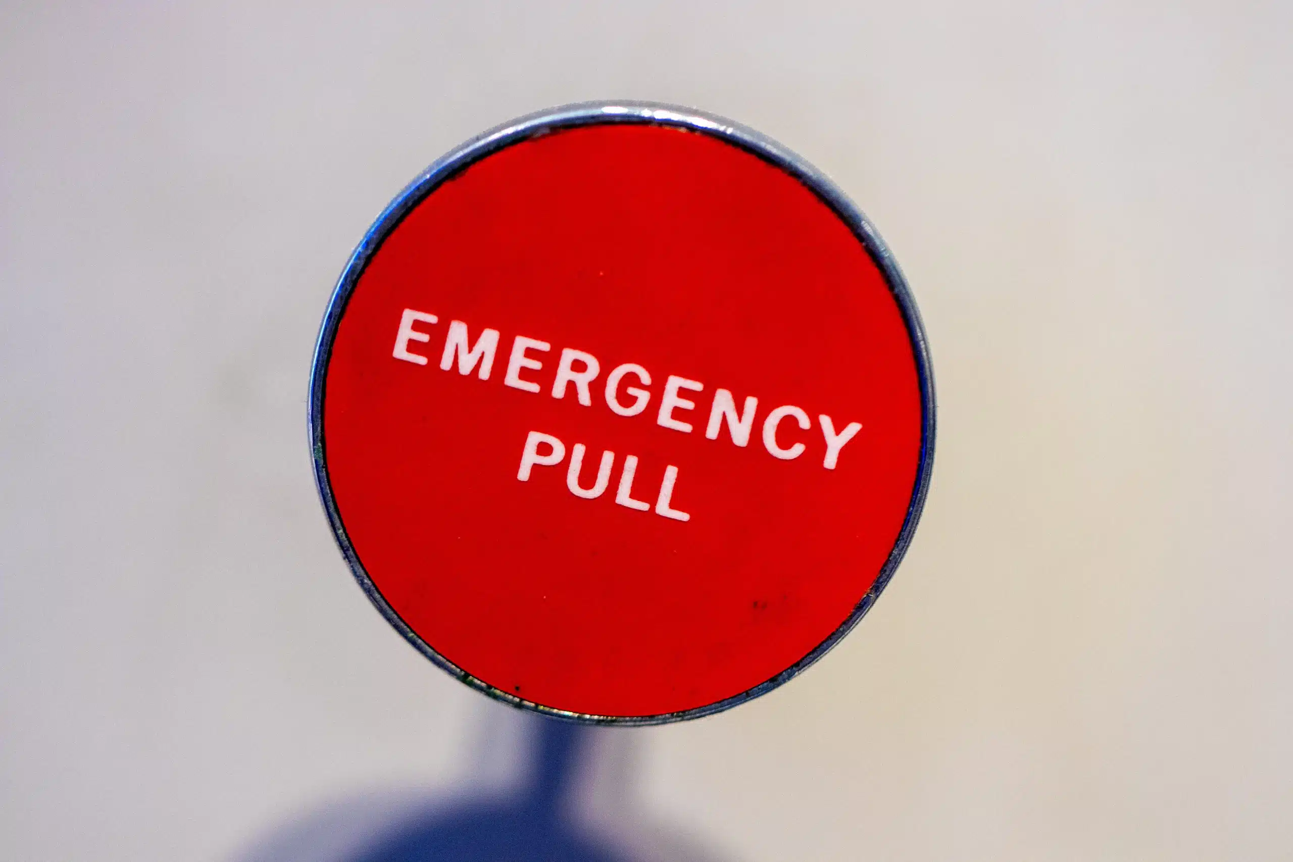 Emergency Signage in a red round background