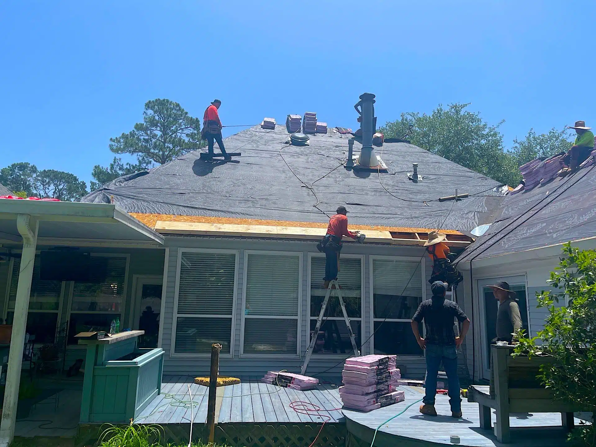 roofing contractors repairing a roof