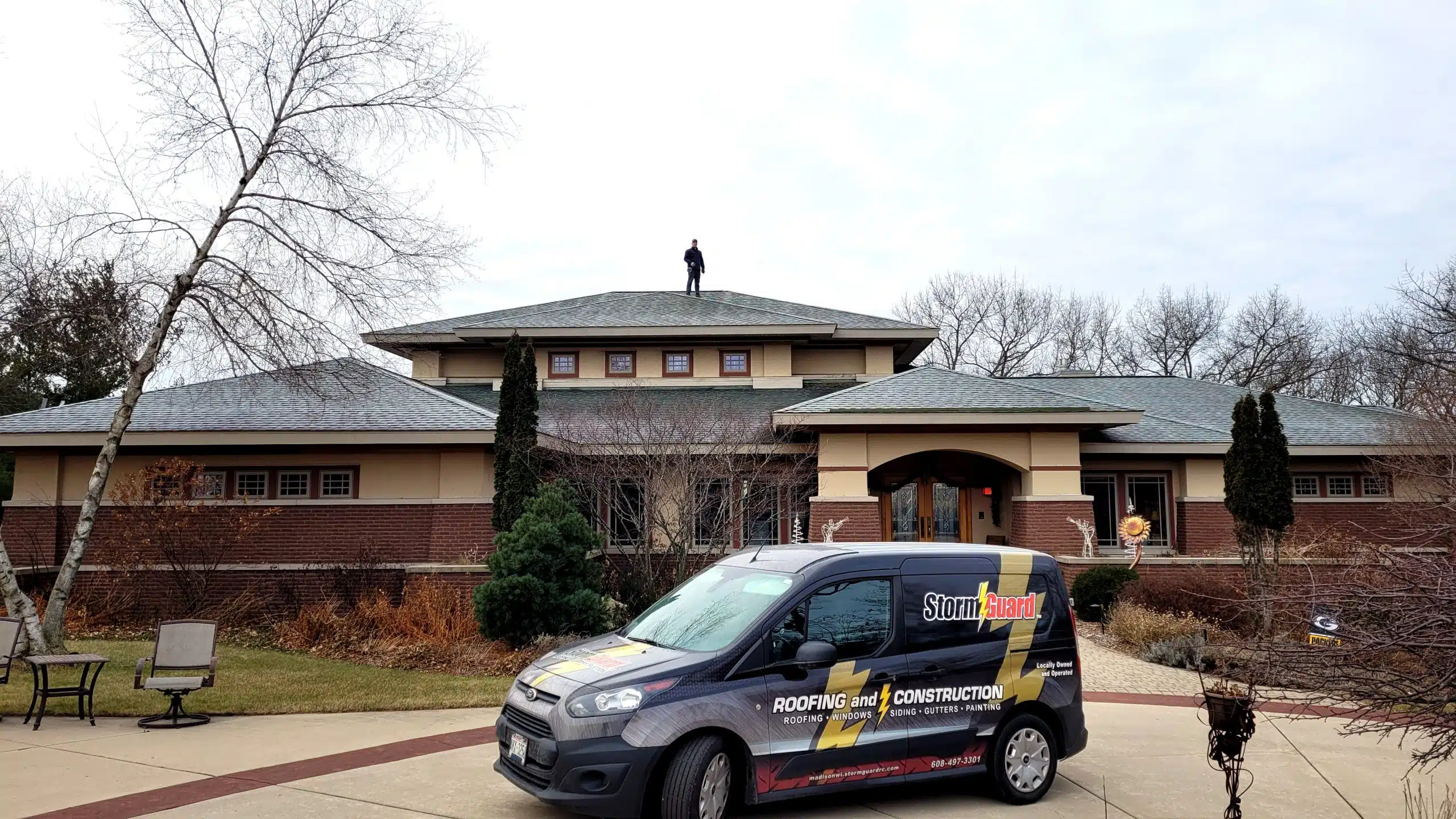 Brick House with Storm Guard Restoration Services Truck In Driveway - Madison