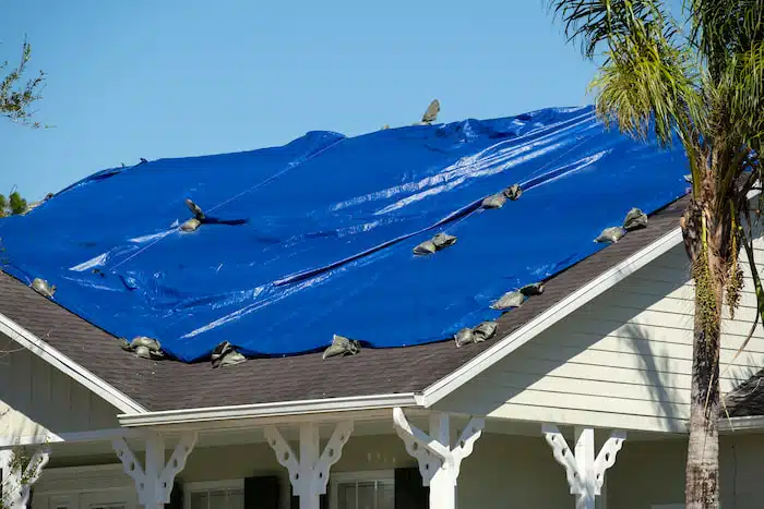 temporary sealing damaged area by roof tarping in sarasota