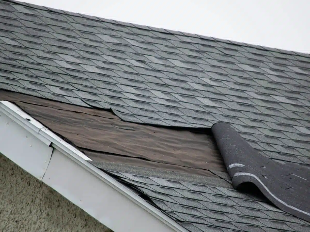 damages shingles due to storm