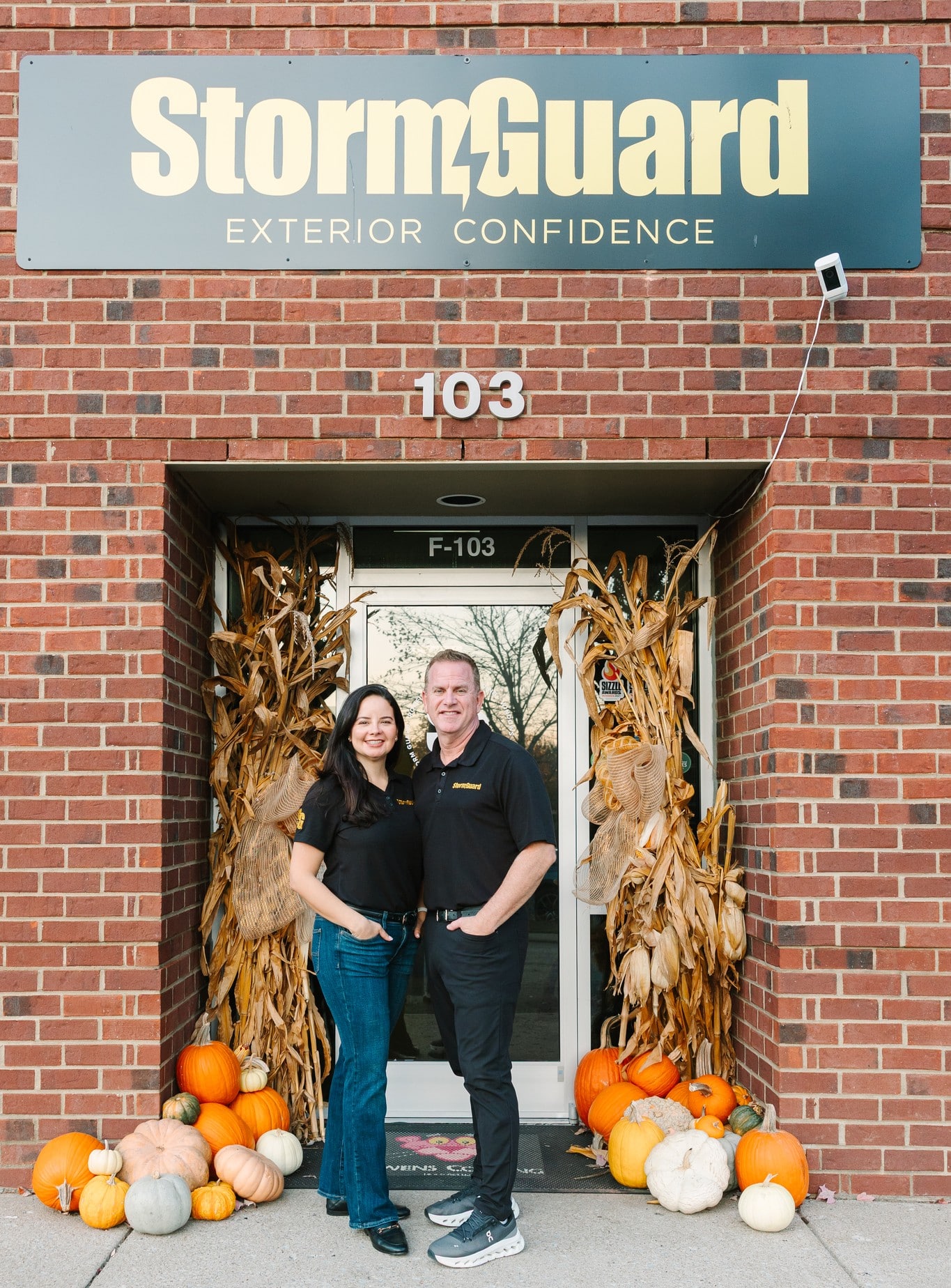 StormGuard Exterior Confidence office entrance with team members standing in front