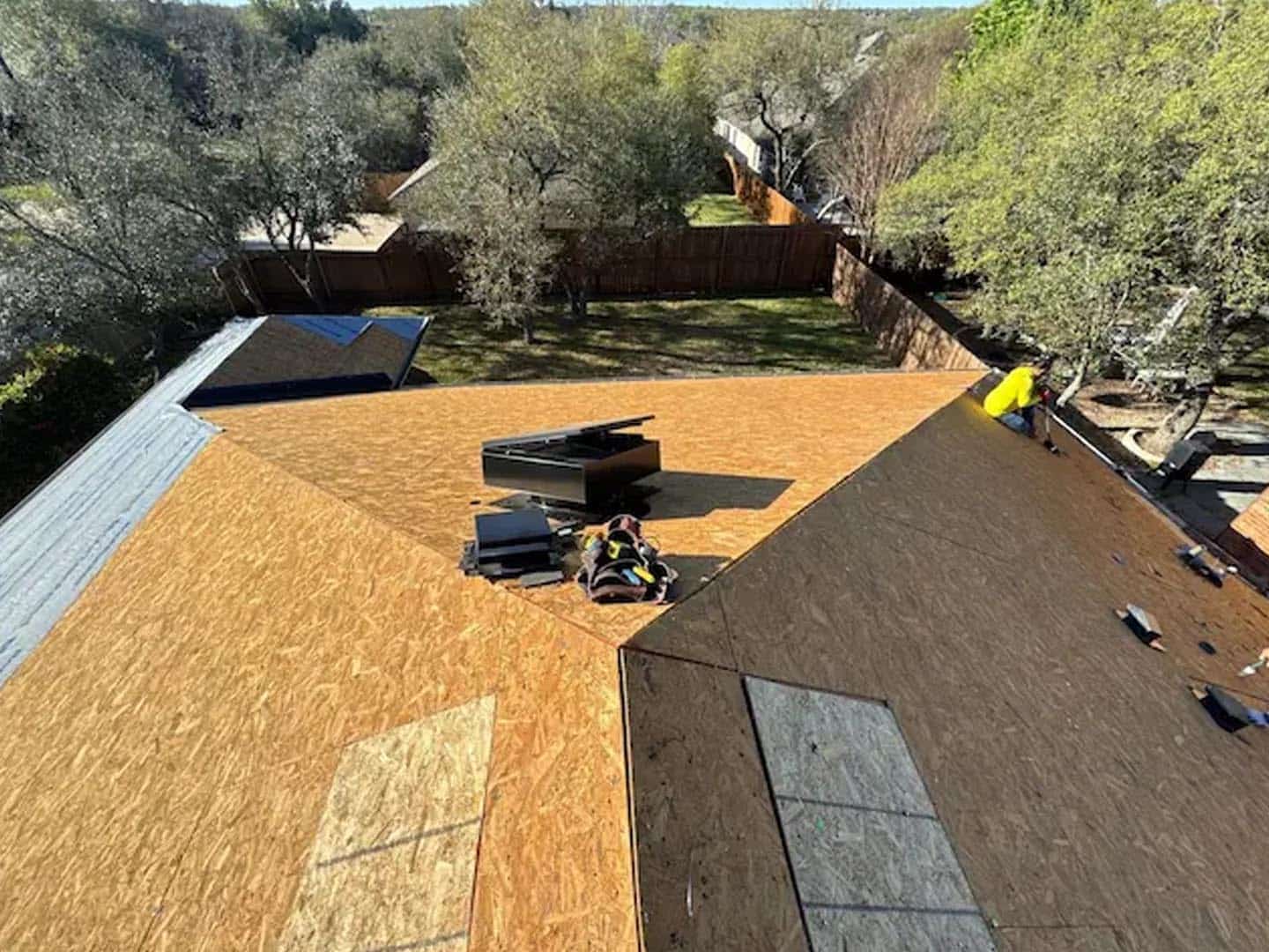 Clean plywood roof decking exposed after a full tear-off by Storm Guard in the Circle C neighborhood of Austin,TX